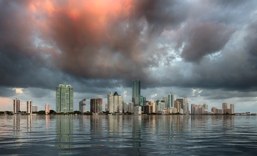 Dawn view of Miami Skyline reflected in water